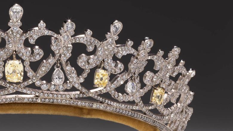 Close-up of the left corner of a dazzlingly bejeweled tiara.