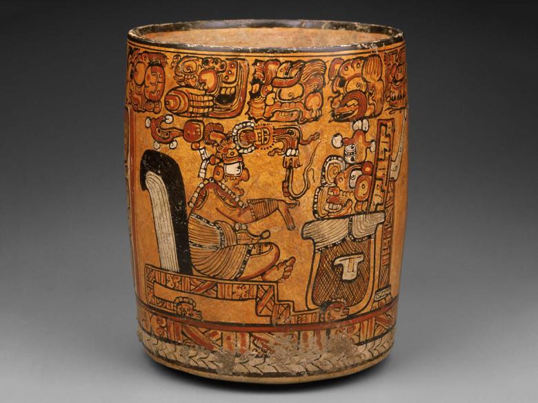 Cylindrical vase with a seated man across its surface.