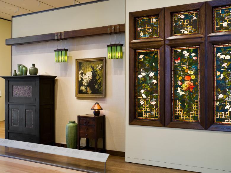 View of various decorative art pieces in American Arts and Crafts gallery