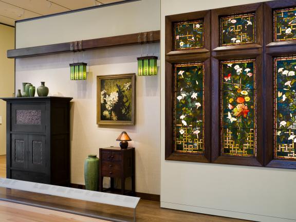 View of various decorative art pieces in American Arts and Crafts gallery