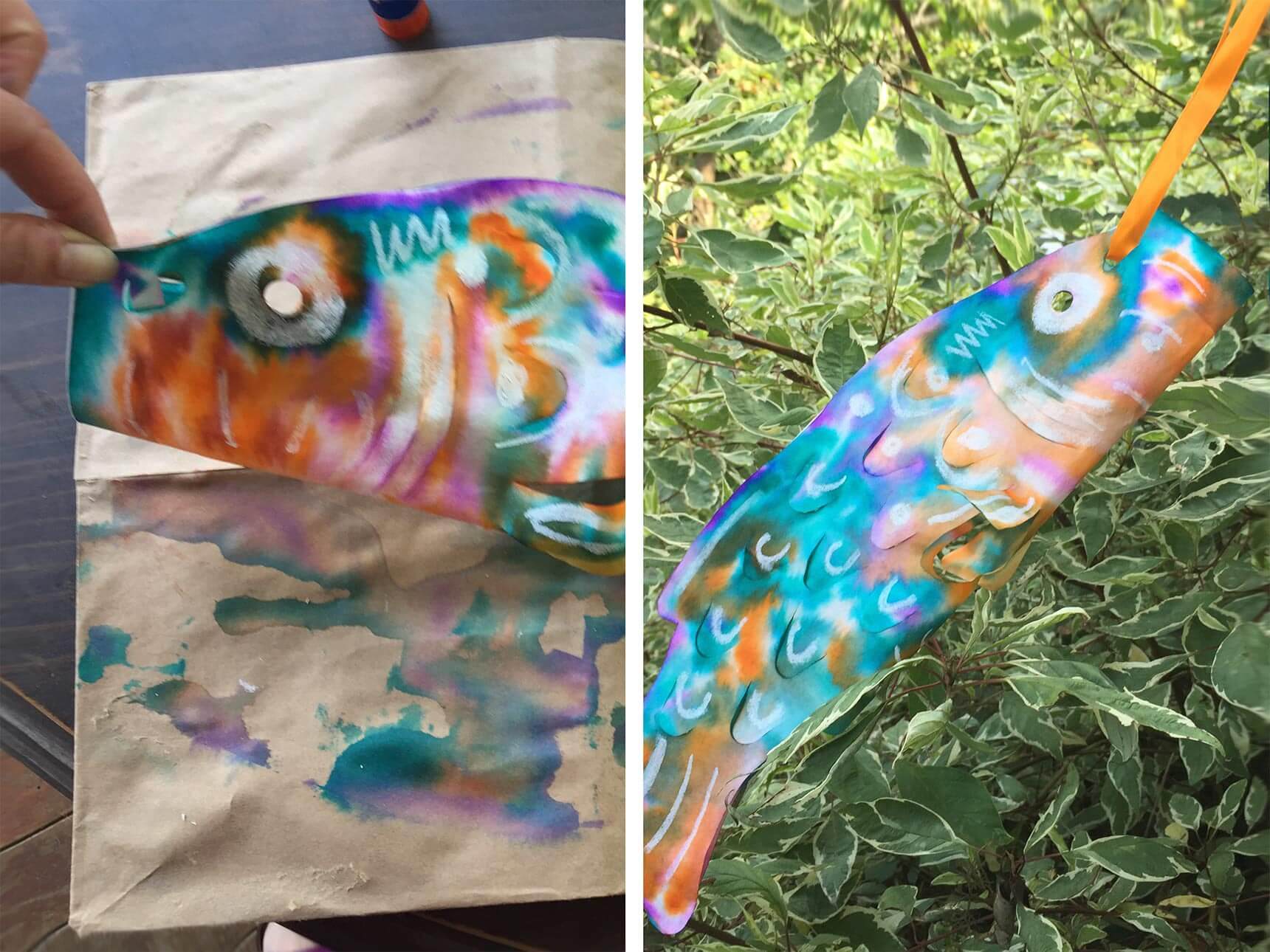 Folding the fish template in half and threading ribbon through holes near the fish's mouth