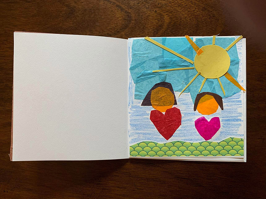 finished mixed media collage depicting colorful house with sun shining on it