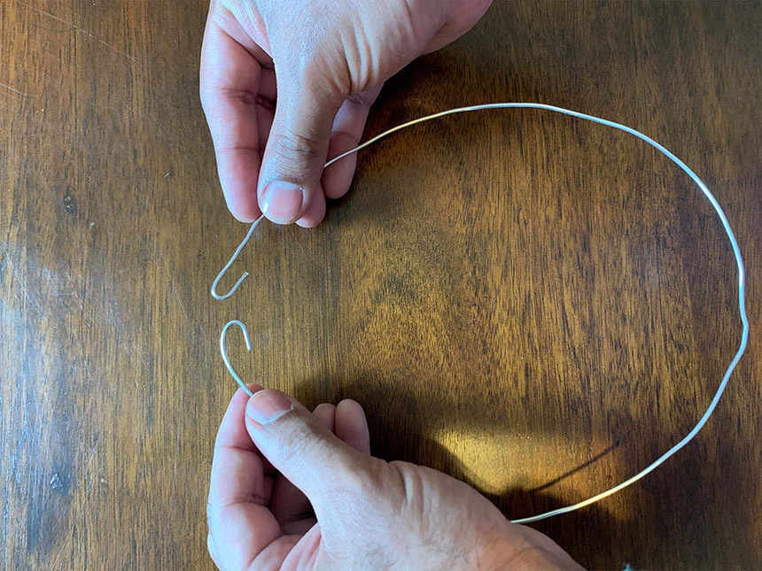 ends of aluminum wire bent into hooks