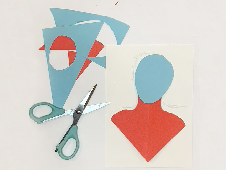 various shapes cut out from construction paper to form figure's head and chest