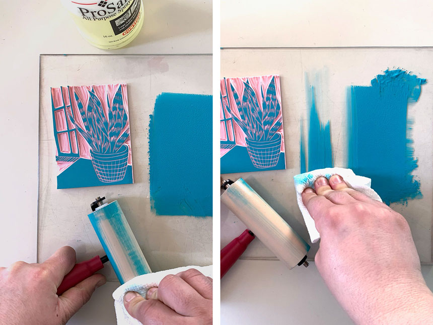 Using paper towel to wipe clean brayer and plexiglass