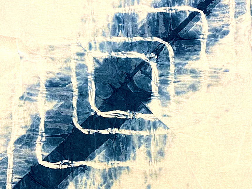 blue dye on white cloth in kanoko pattern
