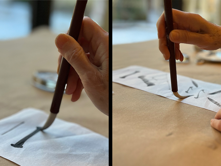 practicing making brush strokes on newsprint