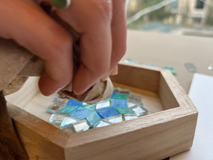 using cloth to dry tile surfaces