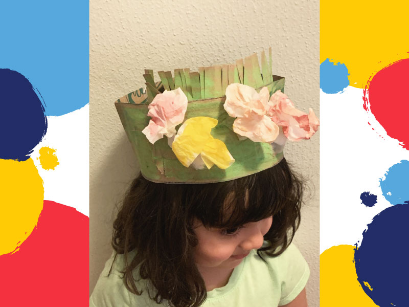 Tissue flowers taped to crown and worn by child