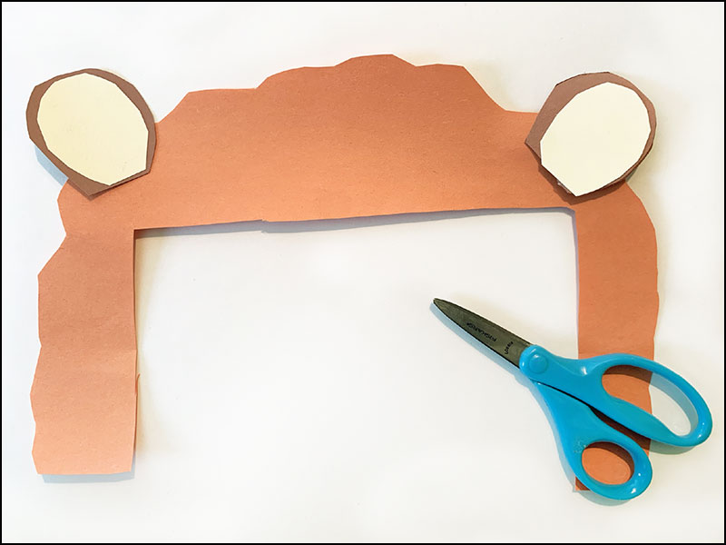 construction paper cut into the shape of lion's mane