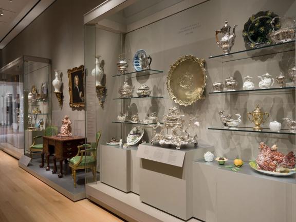 View of display case featuring British decorative arts from 16th through 19th centuries
