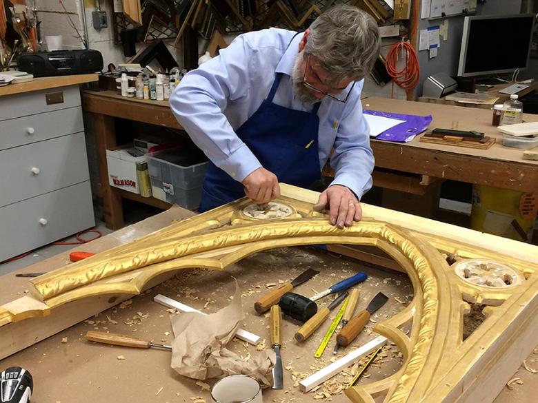 Carving of an element on a reproduction frame