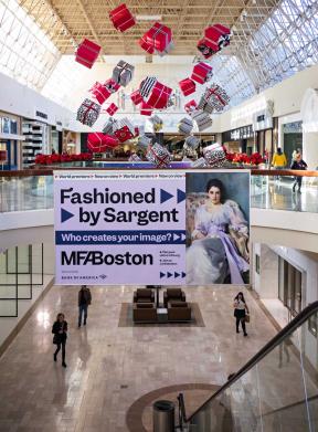 Large "Fashioned by Sargent" banner ad hanging from second floor railing in shopping mall