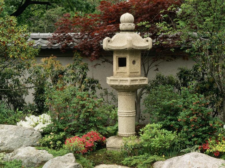 View of Japanese Garden, with stone lantern amidst shrubs