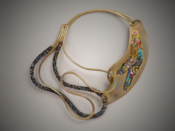 picture of a gold necklace with beads