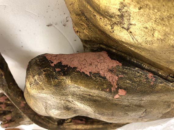 Detail of the Lion Rampant’s thigh with a large area of loss in the gilding