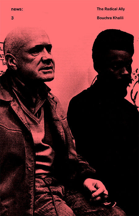 A pink image of two men leaning against a low surface.
