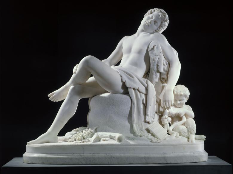 white marble sculpture of a figure laying back and asleep
