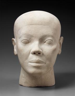 White limestone bust of man's head.