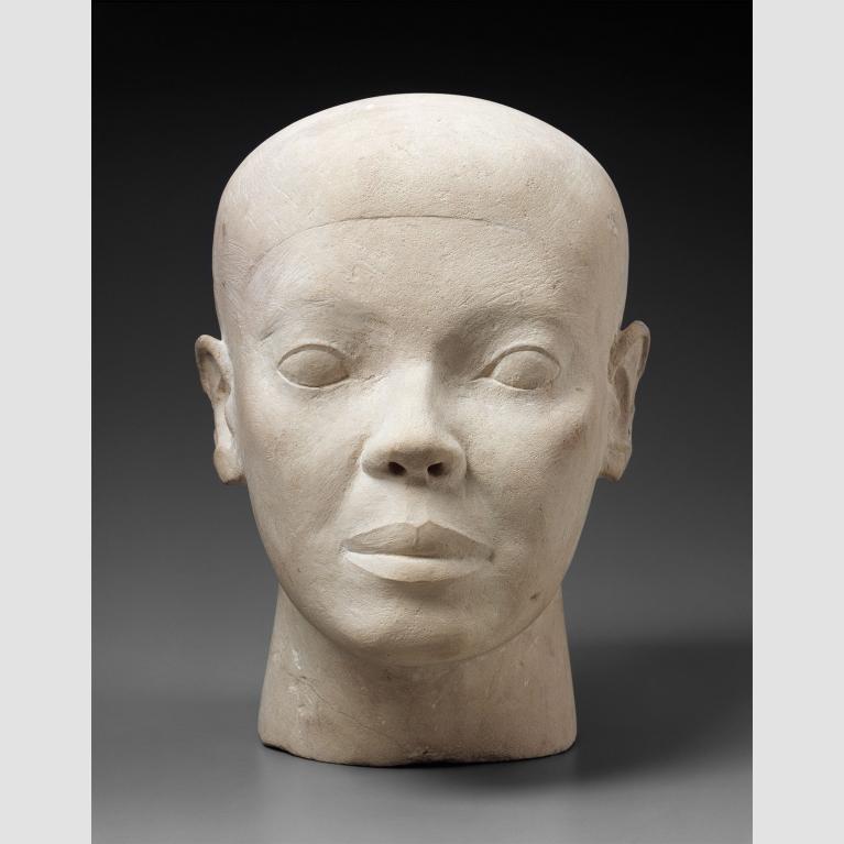 White limestone bust of man's head.