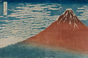 Print depicting a red mountain and blue sky with wispy clouds
