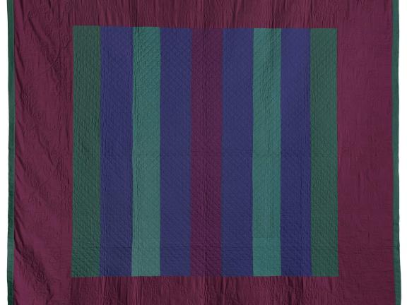 Quilt of purple, green and blue strips