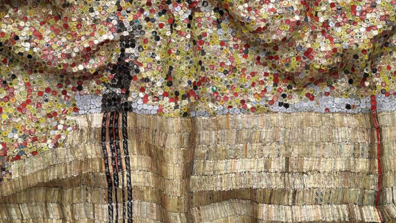 Gold tapestry made from bottle caps and foil