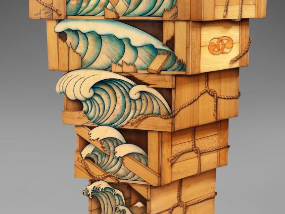 Five stacked wooden boxes with images of waves on the front--the largest one sits on top and each successive one getting progressively smaller.
