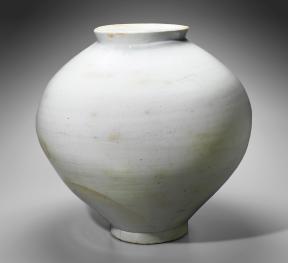 A rotund, white porcelain jar. 