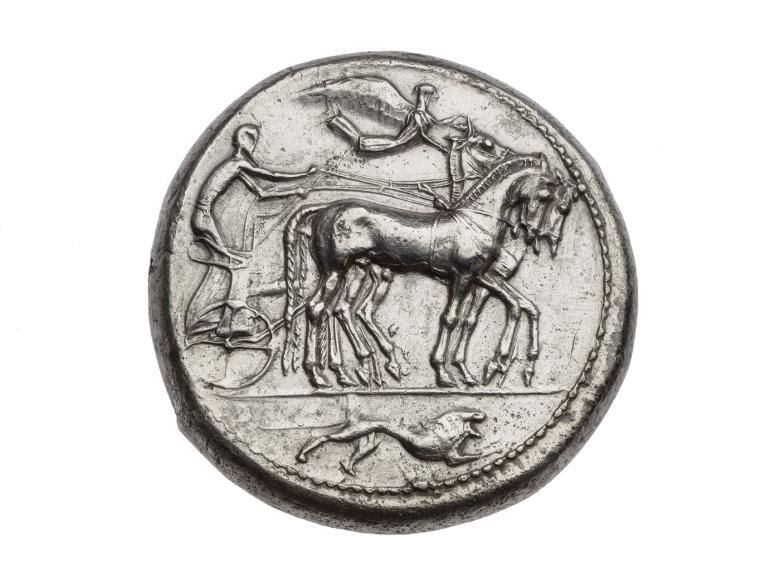Silver coin with image of horse drawn chariot and driver