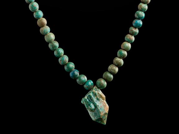 detail of Nubian beaded belt made of faience with glazed quartz pendant