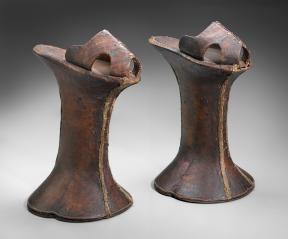 A pair of brown leather platform shoes. 