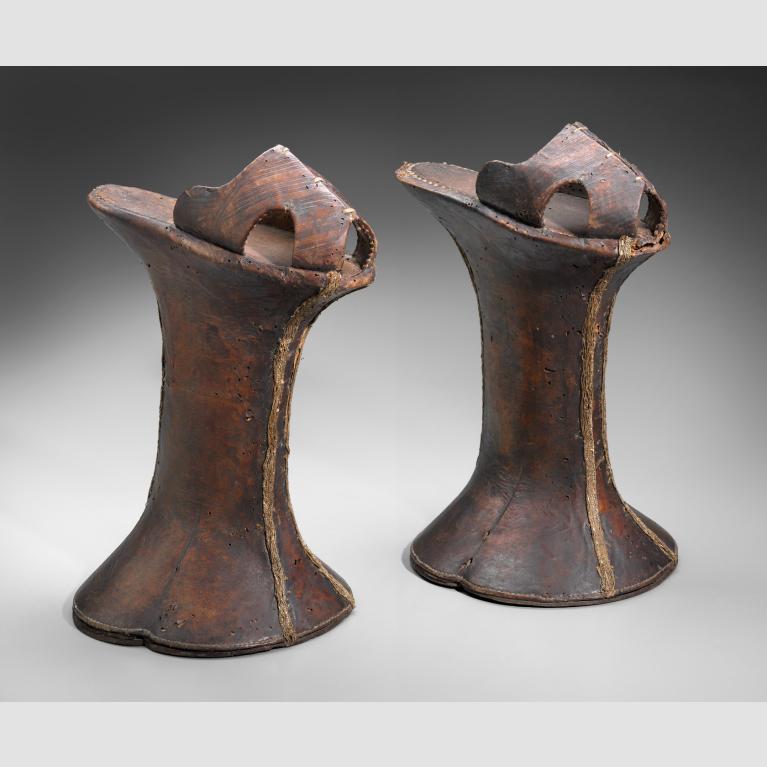 A pair of brown leather platform shoes. 