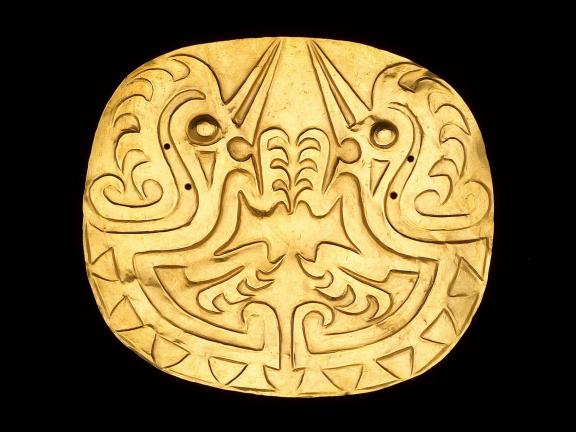 gold embossed disk pectoral depicting two bird-like zoomorphs