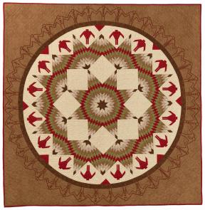 Quilt of browns, reds, and whites with a circle with figures and star shaped patterns