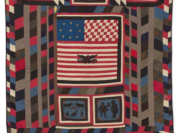 Red, white, blue, black and brown quilt with American flag and scenes of soldiers and animals.