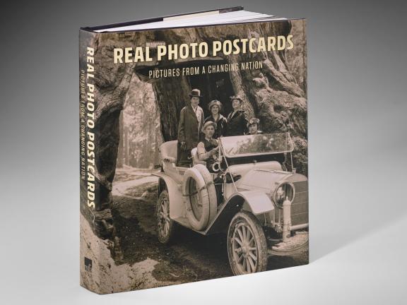 Image of Real Photo Postcards book cover, featuring four smiling people in a roofless car in Redwoods National Park