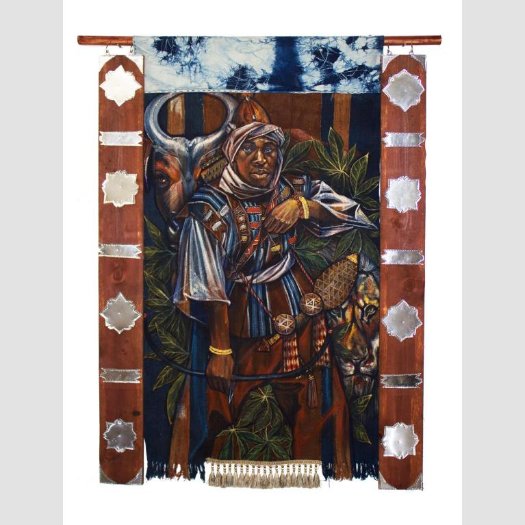 A mixed media, hanging artwork of two wooden panels adorned with metallic shapes flanking dyed cloth. The main image of the cloth is a man, Sundiata Keita, surrounded by plants, an ox, and a lion. 