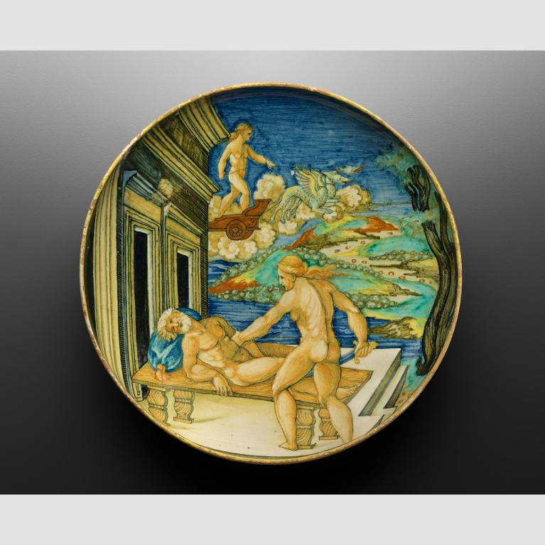 A glazed, round dish depicting Medea and Aeson.