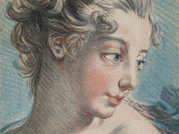 A colorful, engraved piece of metal with the portrait of a young woman whose head is turned toward the right.