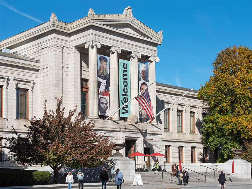 Huntington Avenue facade of Museum with Hear All Belong banners hanging above entrance