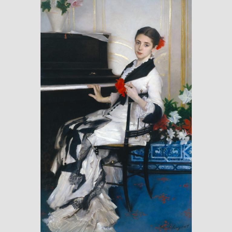 A portrait of Madame Ramón Subercaseaux wearing a white gown and red flower in her hair while seated at a piano.