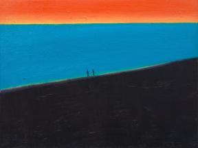 Two people walk along a black-sand beach at sunset.