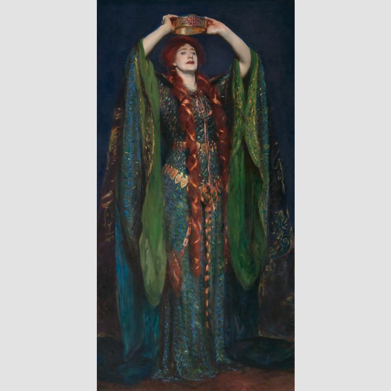 Actress Ellen Terry dressed in a green gown as Lady Macbeth holds a crown over her head. 