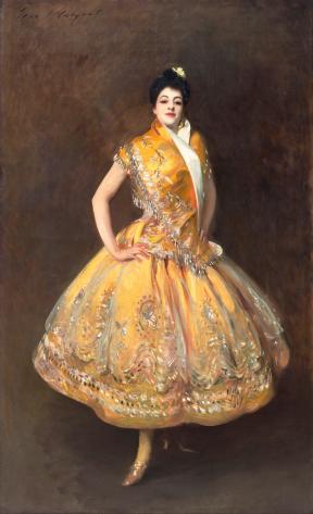A portrait of the Spanish dancer Carmen Moreno in a yellow, beaded dress. 