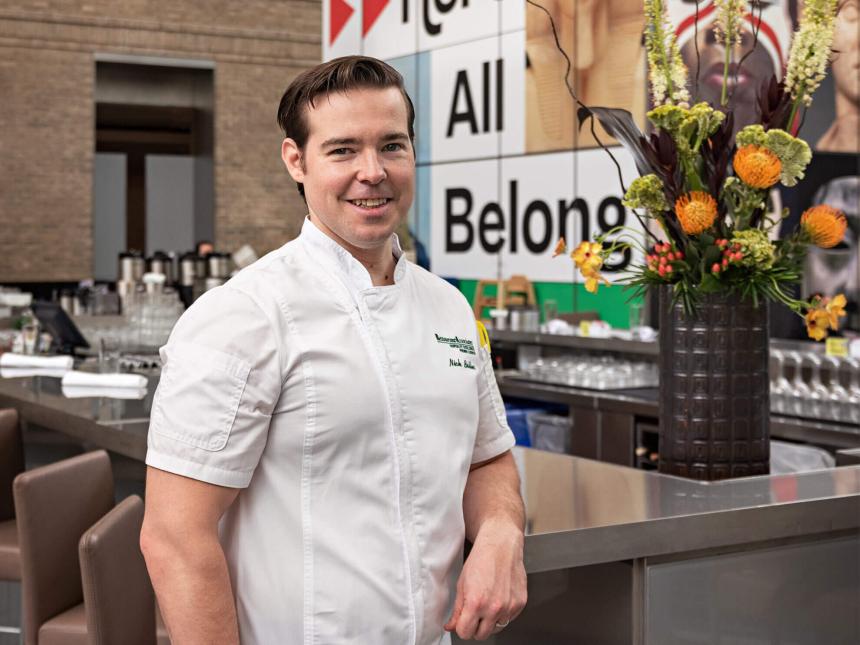 Chef Nicholas Boller standing next to bar at New American Cafe