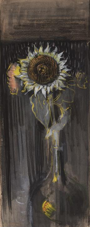 A single sunflower sits in a vase against a dark background.