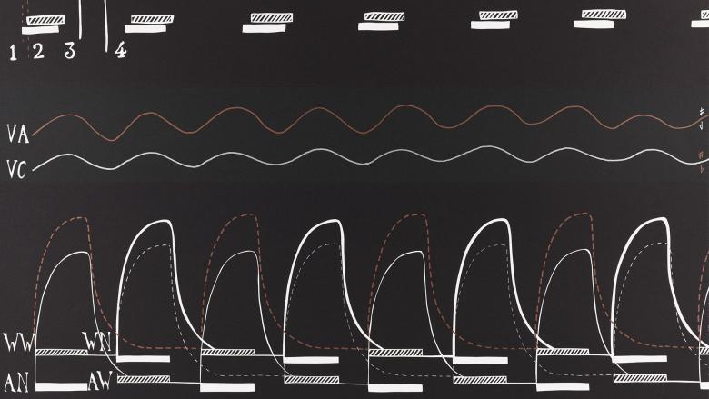 A black graph with white and red letters and wavelengths. 