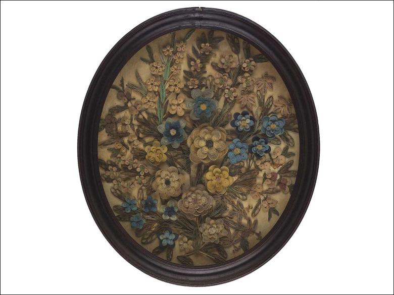 paper quilled flowers in a brown, oval frame