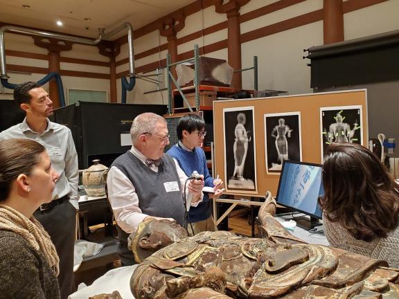 Conservators with Dr. Benjamin Warf and Karl Storz Endovision developers examining the interior of the sculpture with an endoscope